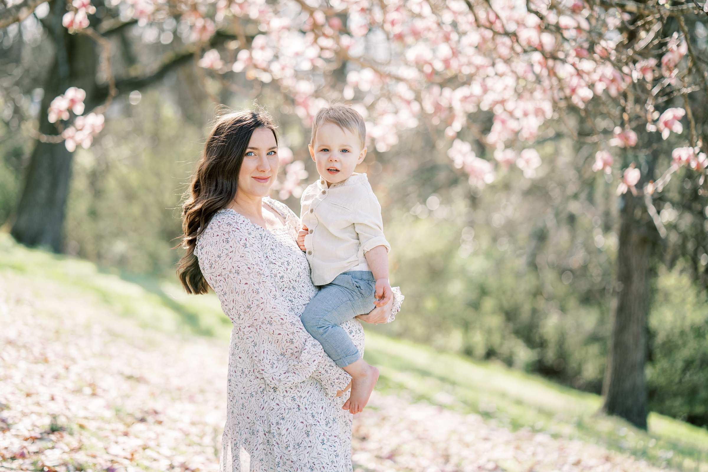 mom holds toddler on baby belly during Nashville TN maternity photos