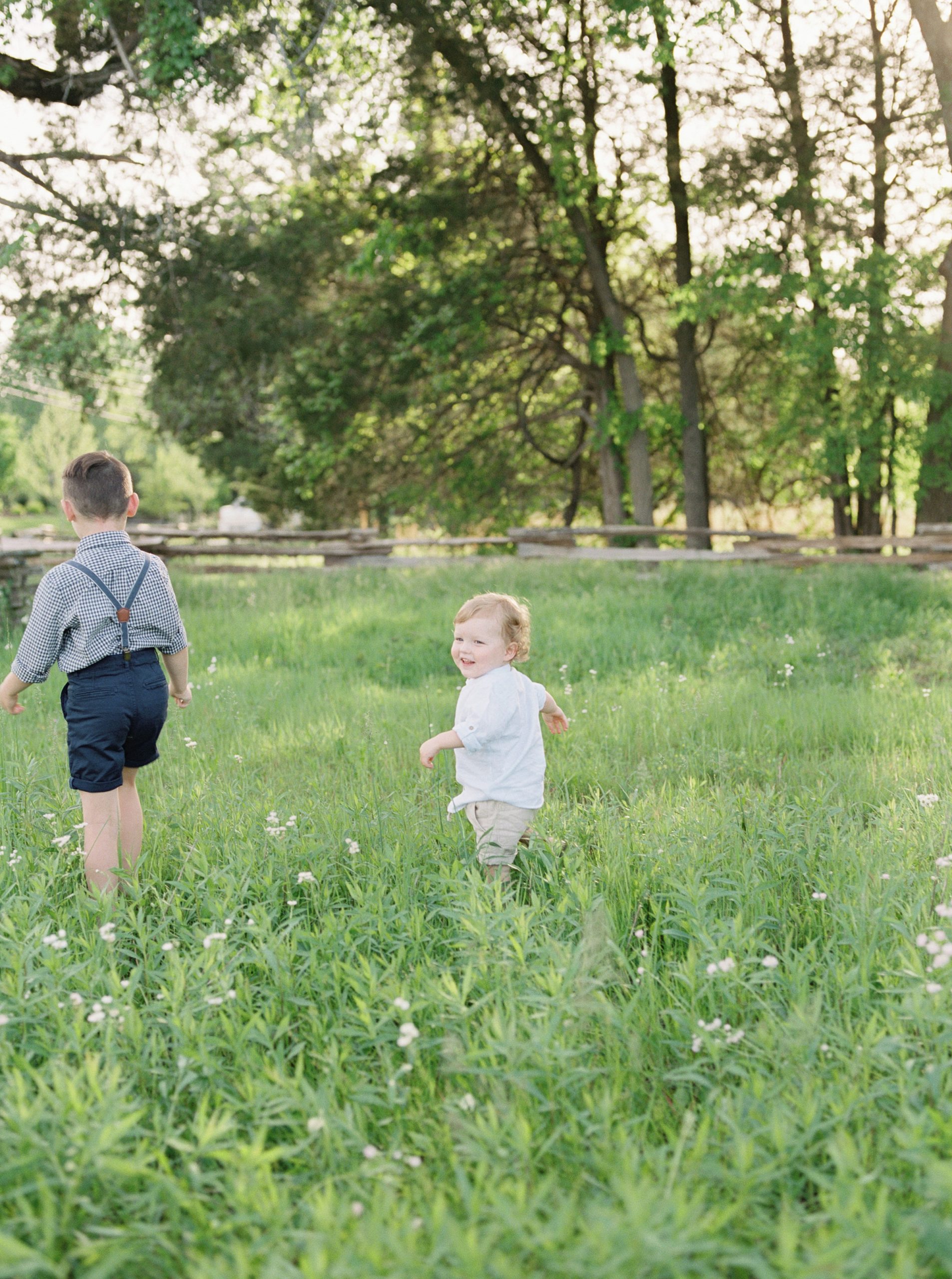 boys run through the fields of Stones River Battlefield in Murfreesboro