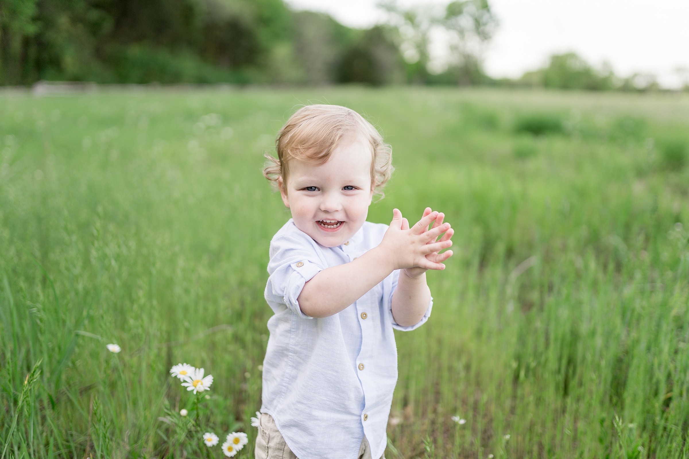 youngest son claps hands together during Murfreesboro TN Family Session