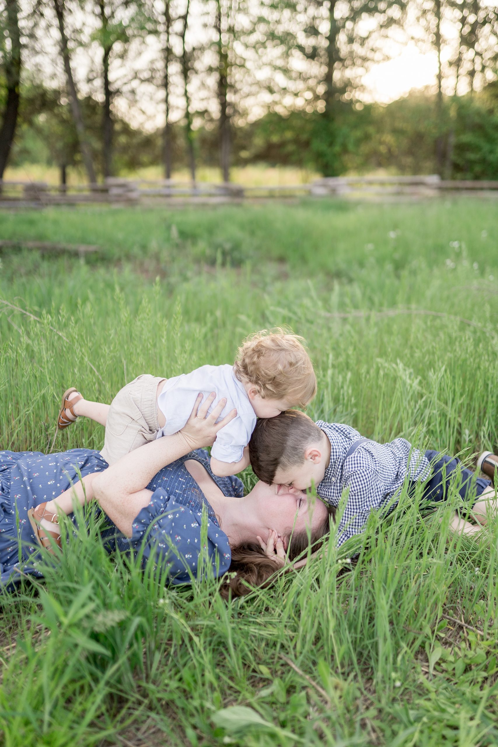 candid moment of Mom and her two boys during Stones River Battlefield Family Session