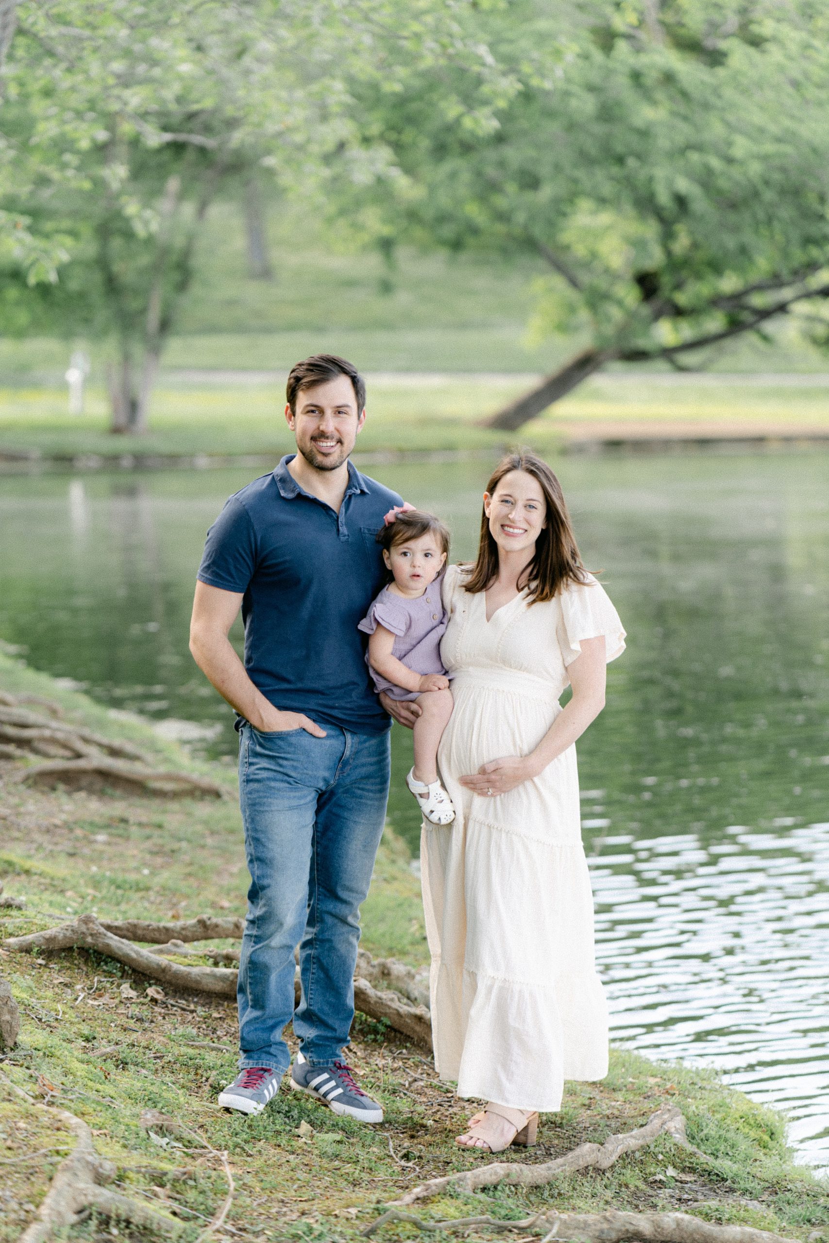 family stands by pond during Nashville family session