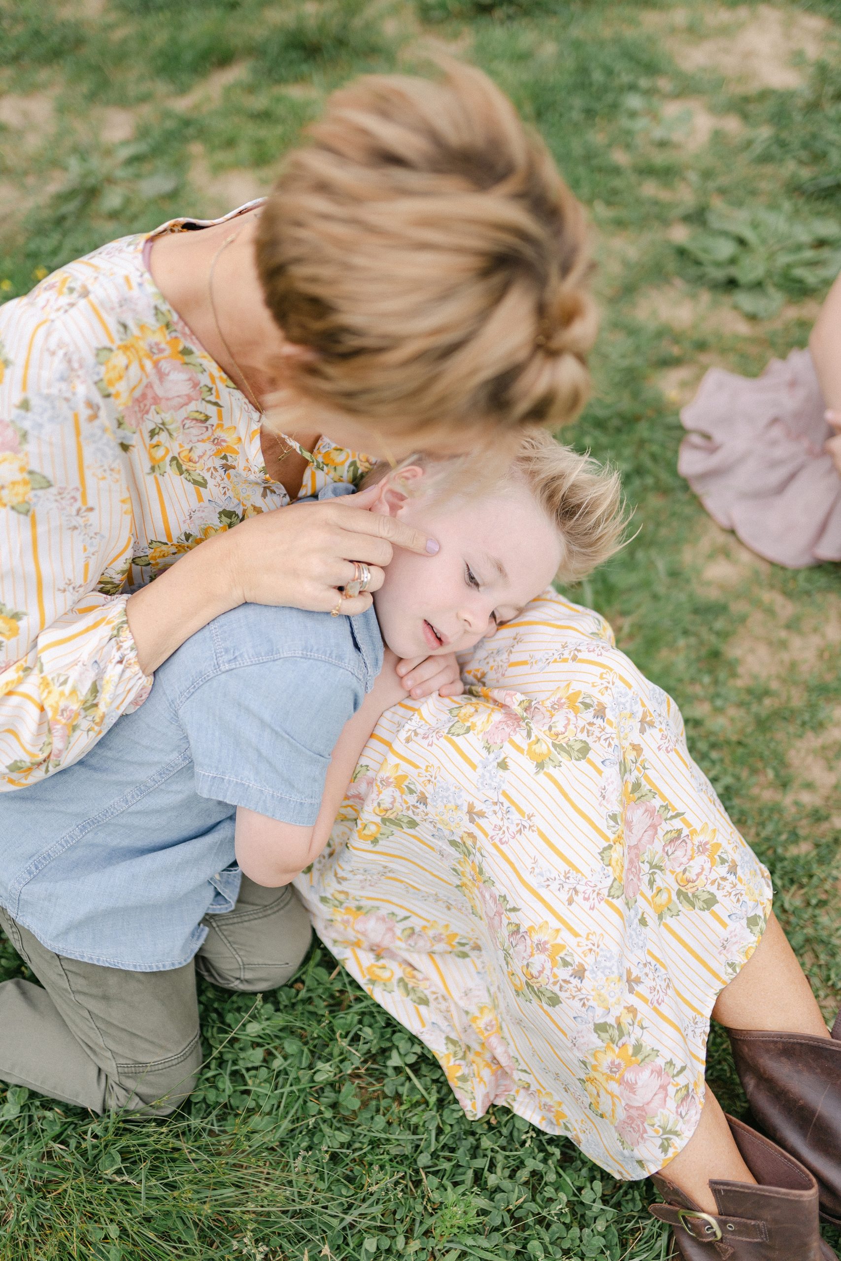 son lays across his mom's lap during Brentwood Family Mini Session