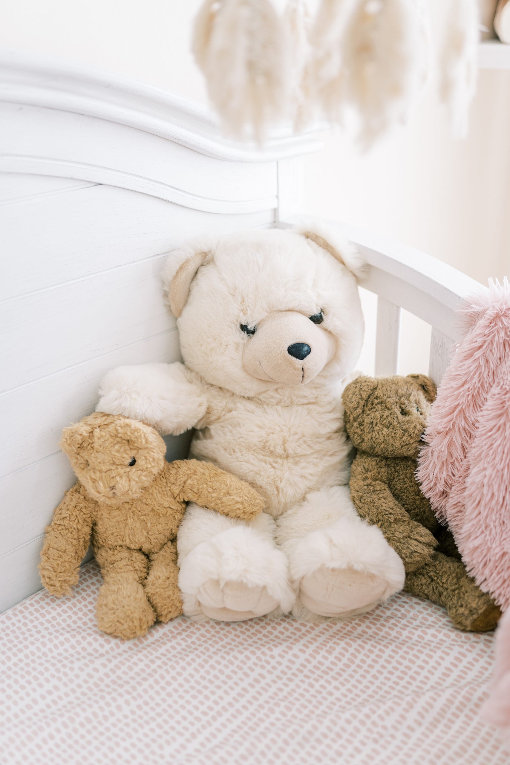 stuffed animals in crib-other details of nursery