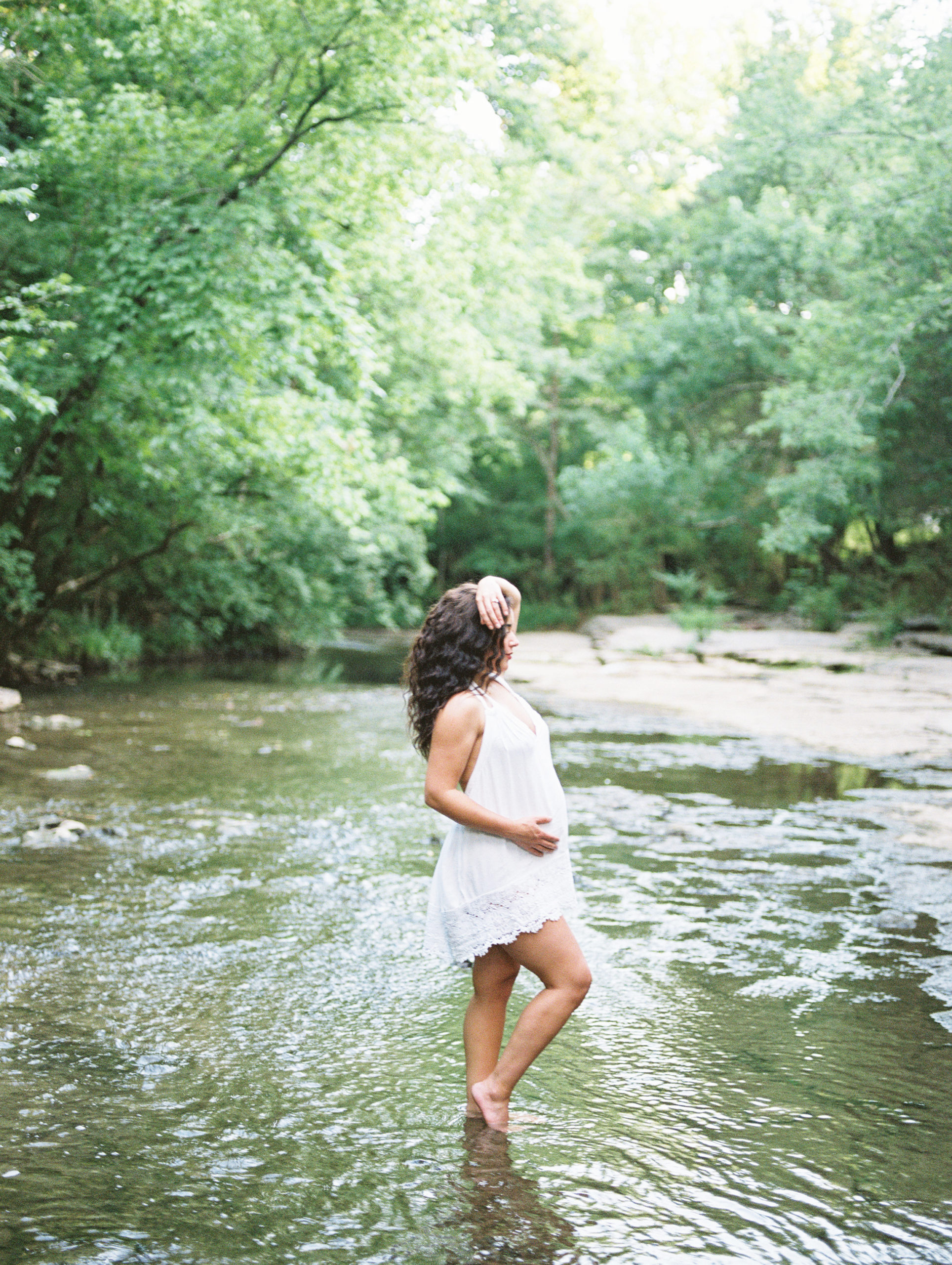 Adventurous Momma poses in creek for Nashville Maternity Session