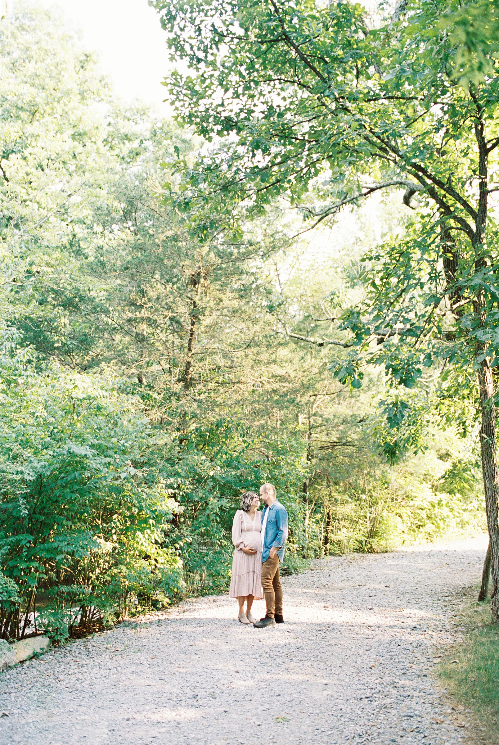 couple on path in wooden area of Ellington Agricultural center in Nashville TN